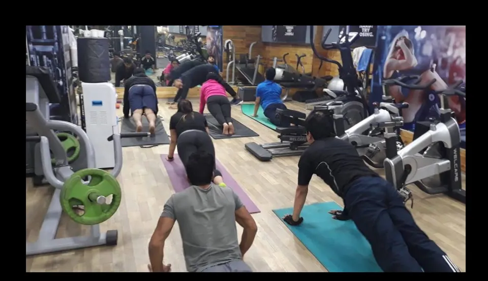 A group of members midway through a training session on the gym floor at Fitness Factor.